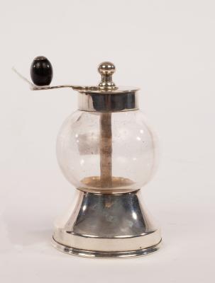 A spherical glass pepper mill
