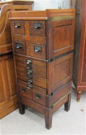 A STACKING OAK FILE CABINET Th