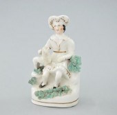 A Staffordshire Figural Seated