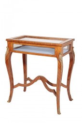 A STAINED HARDWOOD, PROBABLY T
