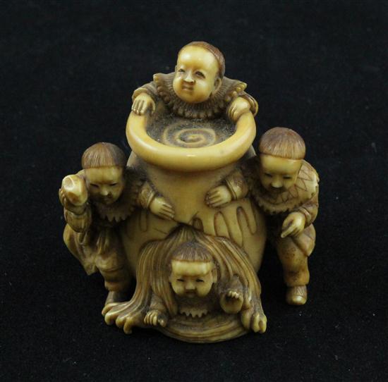 A stained ivory netsuke carved with
