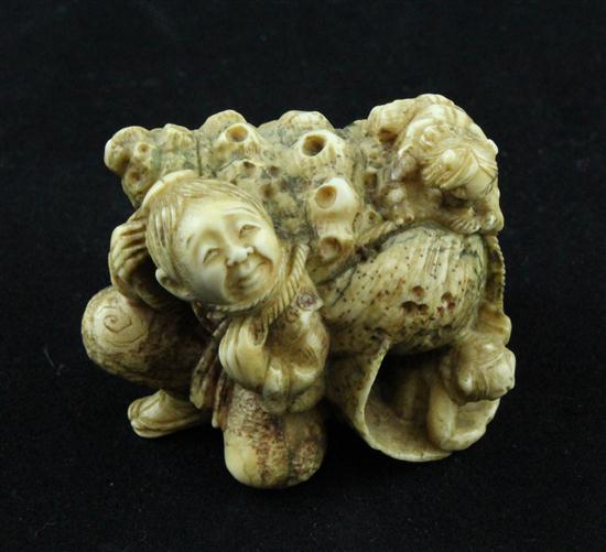 A stained ivory netsuke carved as a
