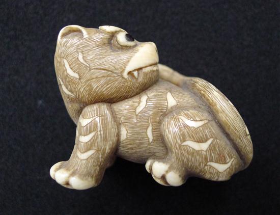 A stained ivory netsuke carved as a