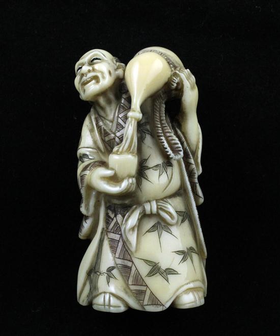 A stained ivory netsuke carved as a