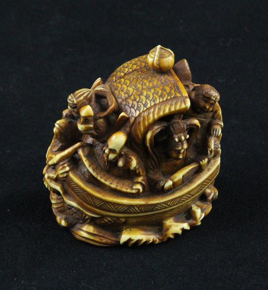 A stained ivory netsuke carved as