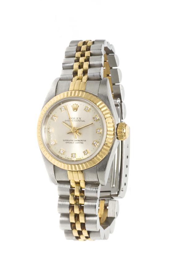 * A Stainless Steel 18 Karat Yellow