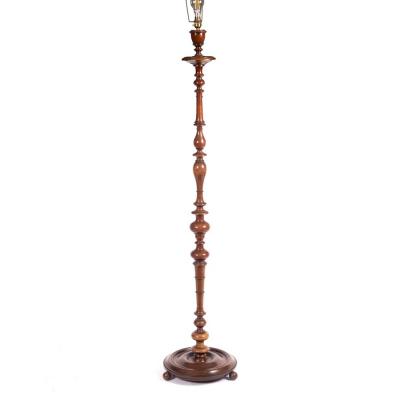 A standard lamp of turned form on a