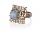 A STAR SAPPHIRE AND DIAMOND RI