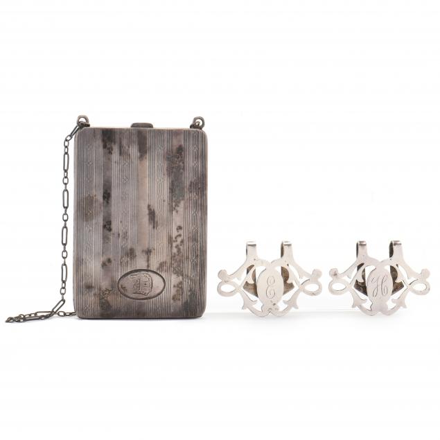 A STERLING SILVER COIN PURSE AND