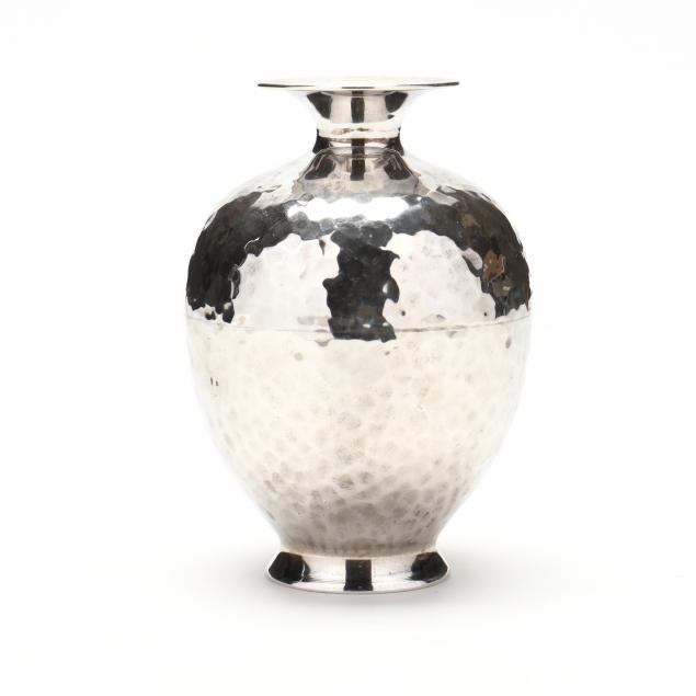 A STERLING SILVER HAMMERED BUD VASE