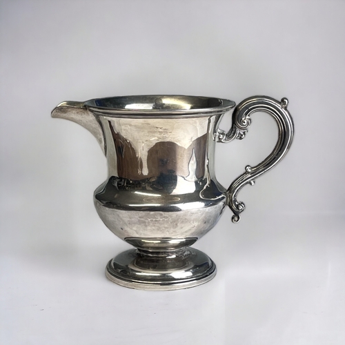 A  STERLING SILVER MILK JUG. Edward