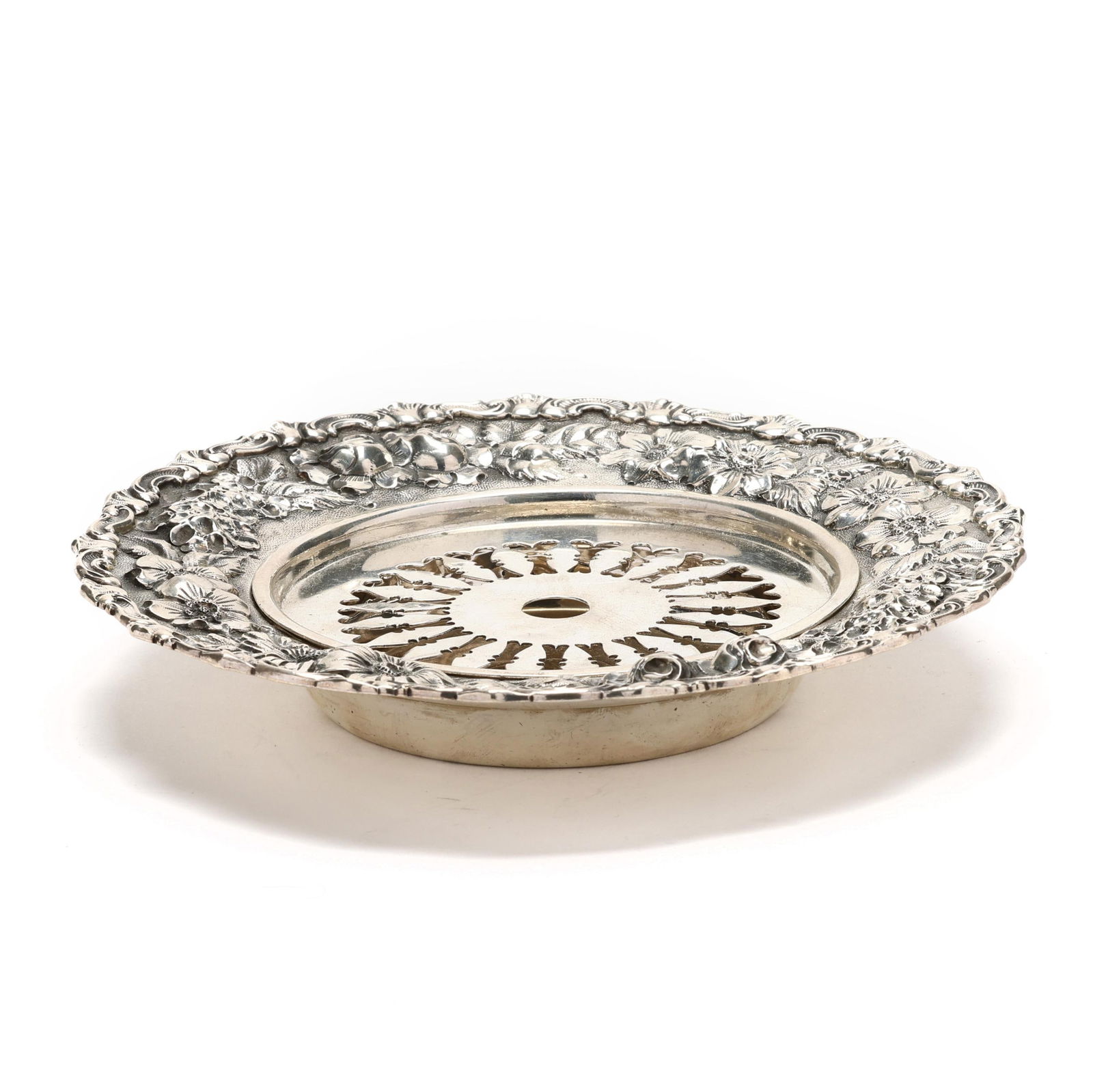 A STERLING SILVER REPOUSSE BUTTER