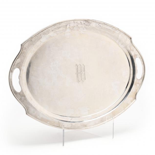 A STERLING SILVER SERVING WAITER