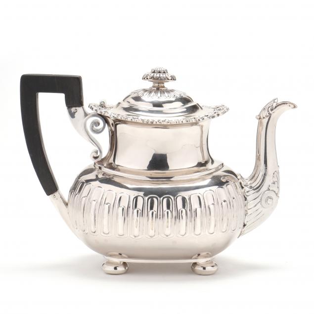 A STERLING SILVER TEAPOT BY