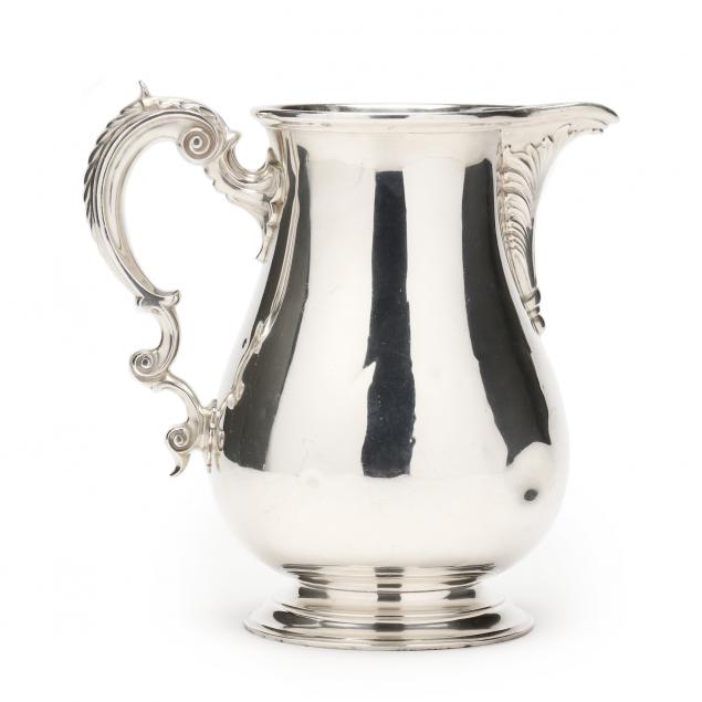 A STERLING SILVER WATER PITCHER