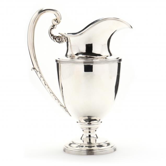 A STERLING SILVER WATER PITCHER