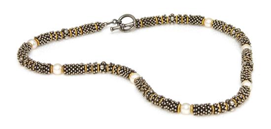 A Sterling Silver Yellow Gold and
