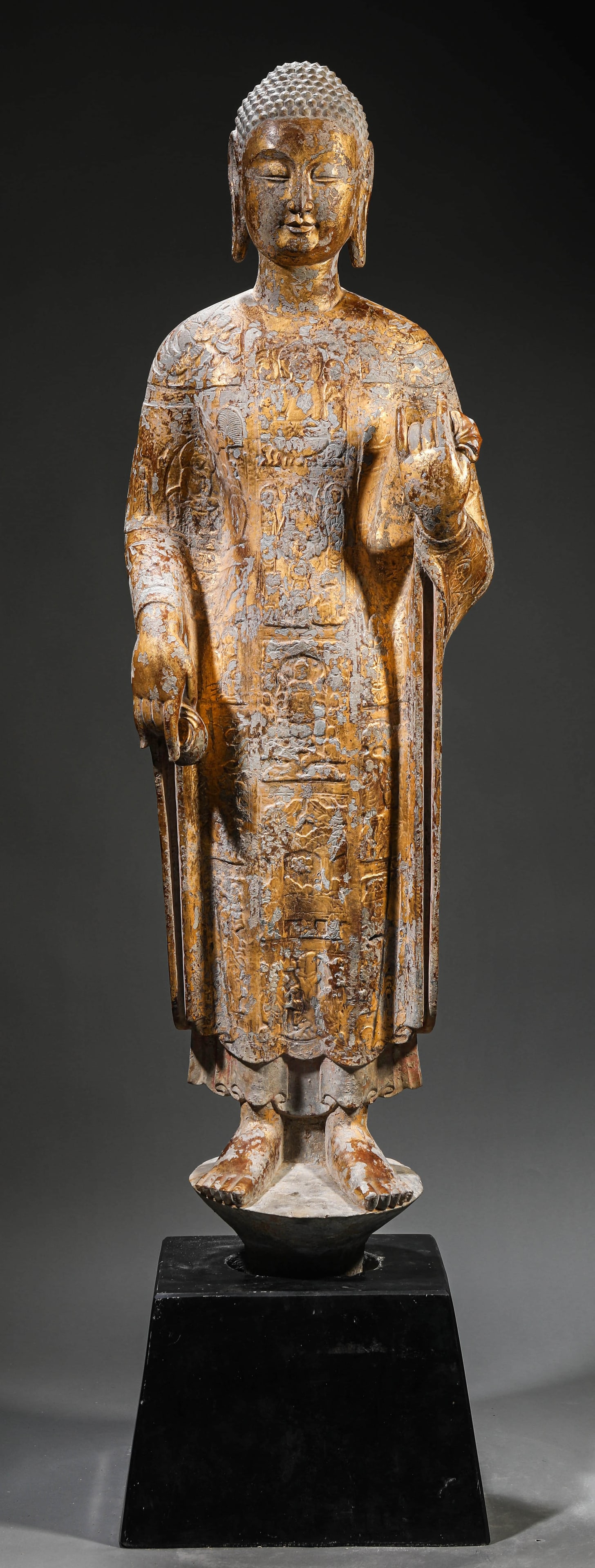 A STONE CARVED AND GILT