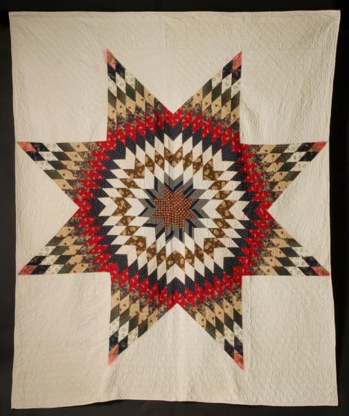 A STRIKING LONE STAR QUILT WITH