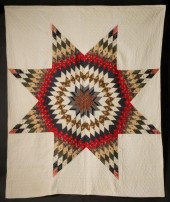 A STRIKING LONE STAR QUILT WIT