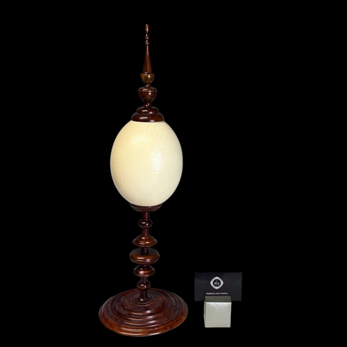 A TALL OSTRICH EGG STAND.20th