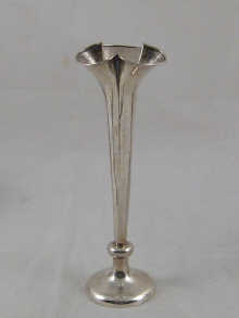 A tall silver specimen vase of