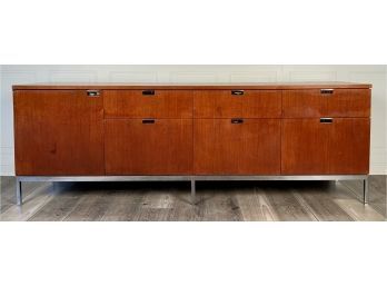 A teak sideboard with an