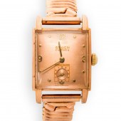 A TEN KARAT ROSE GOLD FILLED W