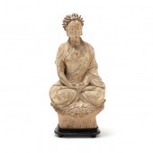 A TERRACOTTA BUDDHA SCULPTURE