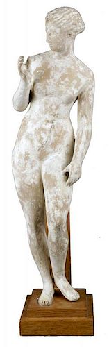 A TERRACOTTA FIGURE OF A STANDING