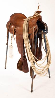 A Texas roping saddle on stand,