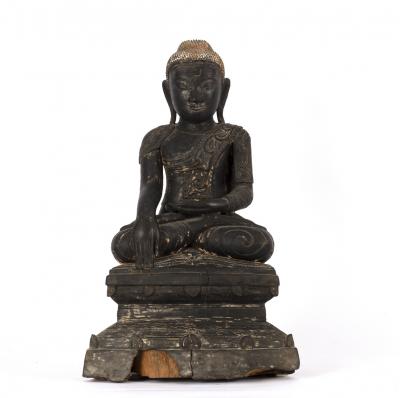 A Thai ebonised carved wood