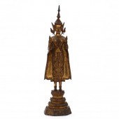 A THAI GILT BRONZE STANDING BU