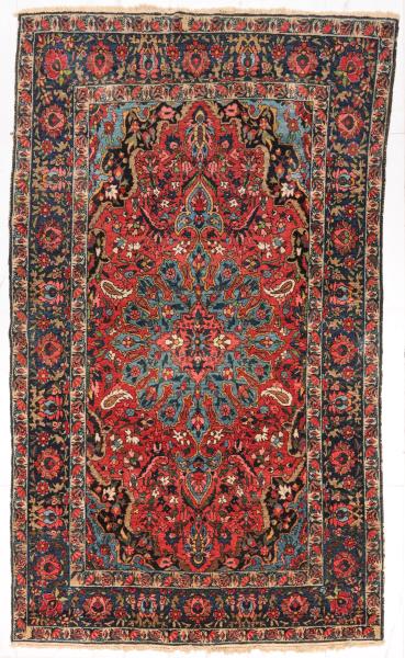 A THIN, ANTIQUE BIDJAR WITH CENTRAL