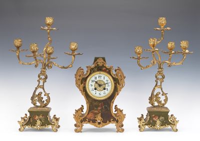 A Three Piece Clock Garniture Set