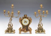 A Three Piece Clock Garniture
