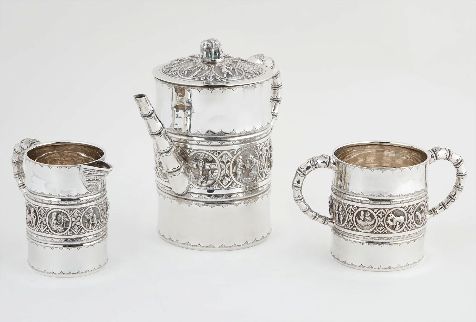A THREE PIECE INDIAN SILVER TEA