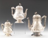 A Three Piece Repousse Coin Si