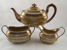 A three piece silver barge shaped