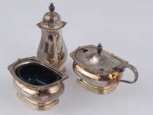 A three piece silver cruet set