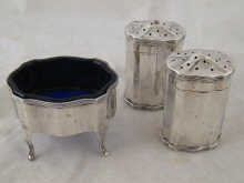 A three piece silver cruet
