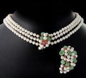 A THREE-STRAND PEARL CHOKER WI