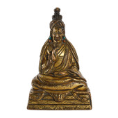 A TIBETAN BRONZE-GILT SEATED M