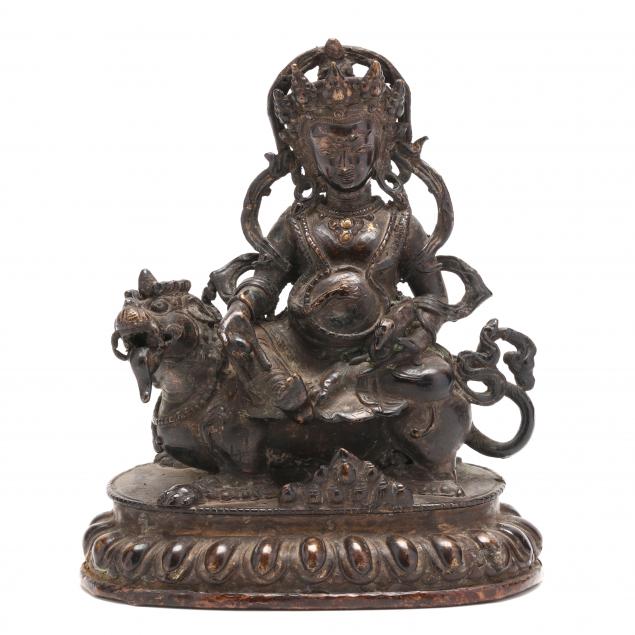 A TIBETAN BRONZE SCULPTURE OF