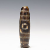 A TIBETAN DZI BEAD<br>A TIBETA