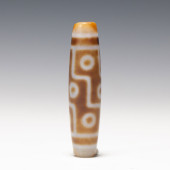 A TIBETAN DZI BEAD<br>A TIBETA
