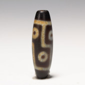 A TIBETAN DZI BEAD<br>A TIBETA