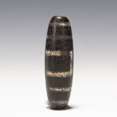 A TIBETAN DZI BEAD<br>A TIBETA
