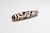 A TIBETAN DZI BEAD<br>A Tibeta