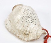A TIBETAN ENGRAVED CONCH SHELL